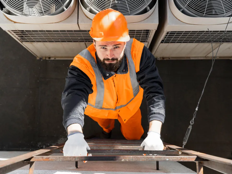 Freshwind AC Service technician installing an outdoor AC unit in Greater Noida