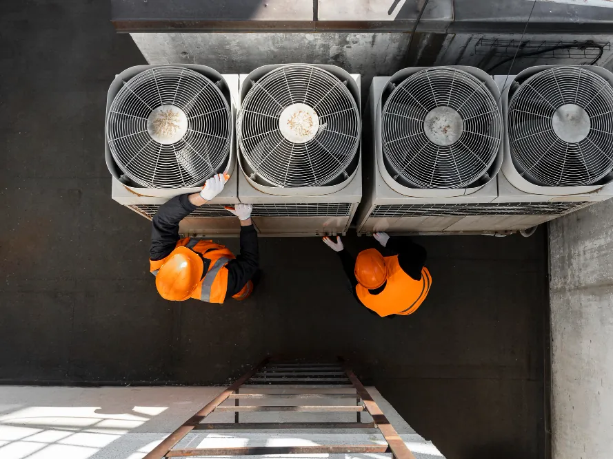 Freshwind AC Service technicians servicing rooftop commercial HVAC units in Greater Noida